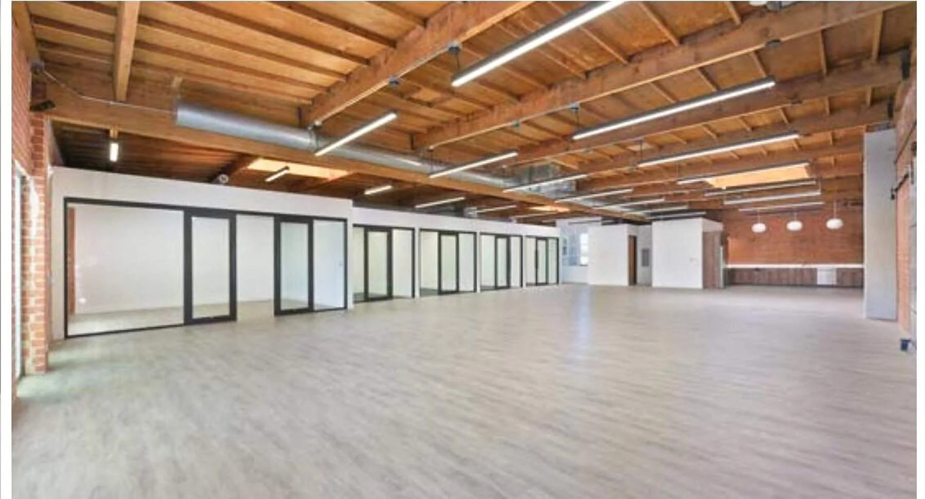 Suite 1524 F and G open loft with private offices, exposed timber and brick