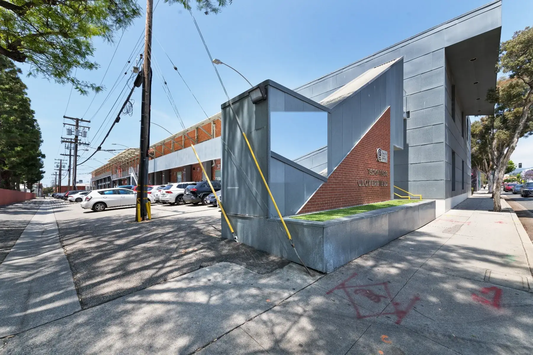 1520 Cloverfield — stainless-steel fascia and brick