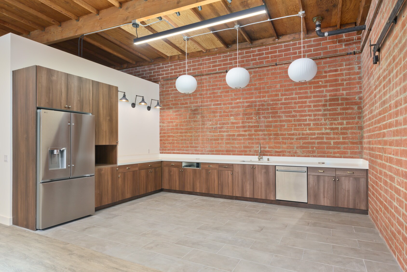 Suite kitchen with exposed brick